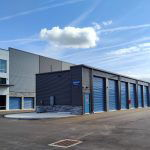 The entire building including blue doored drive-up storage units